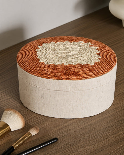 Boite ovale en perle marron et beige - | Maison Baan